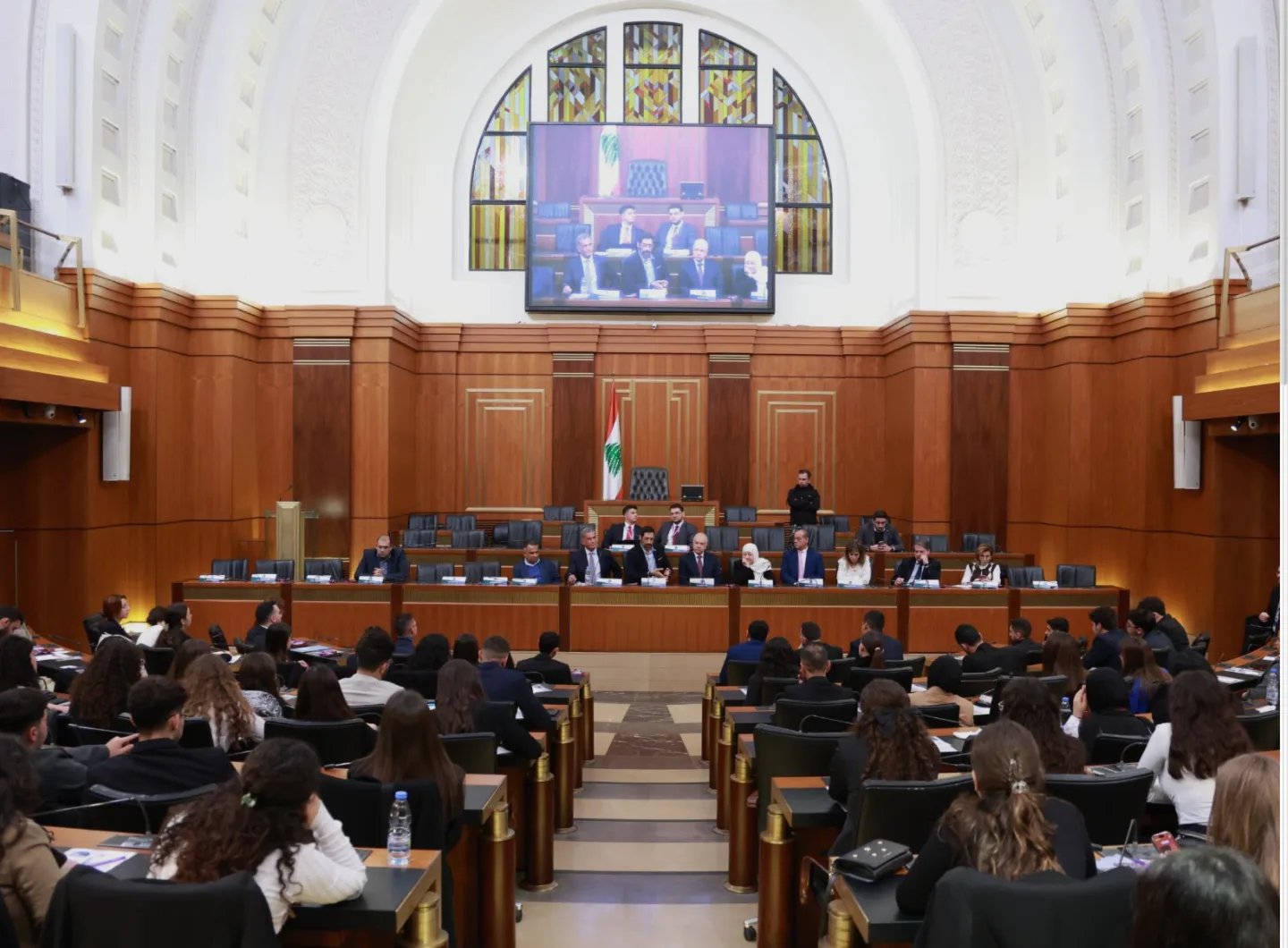 Students seated in a Lebanese parliamentary chamber