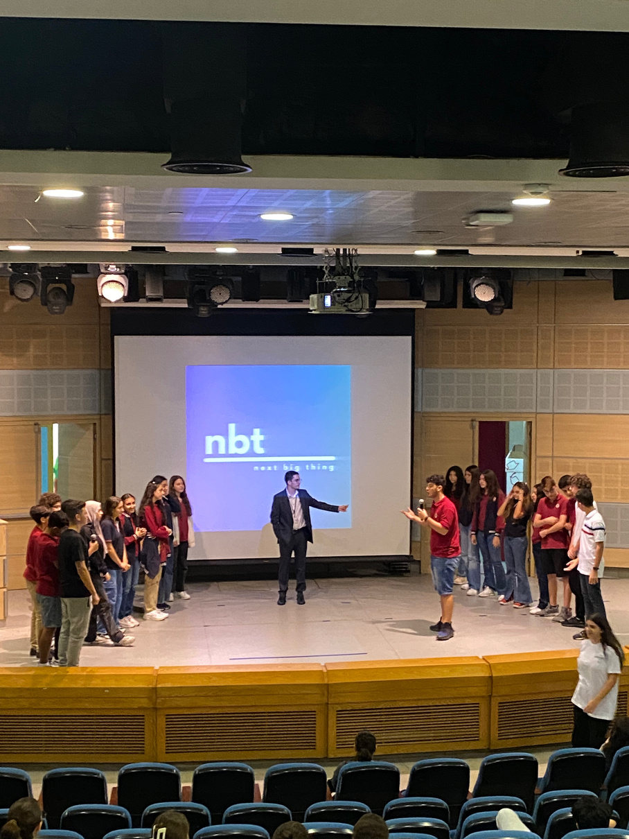 Students on stage during an NBT leadership activity