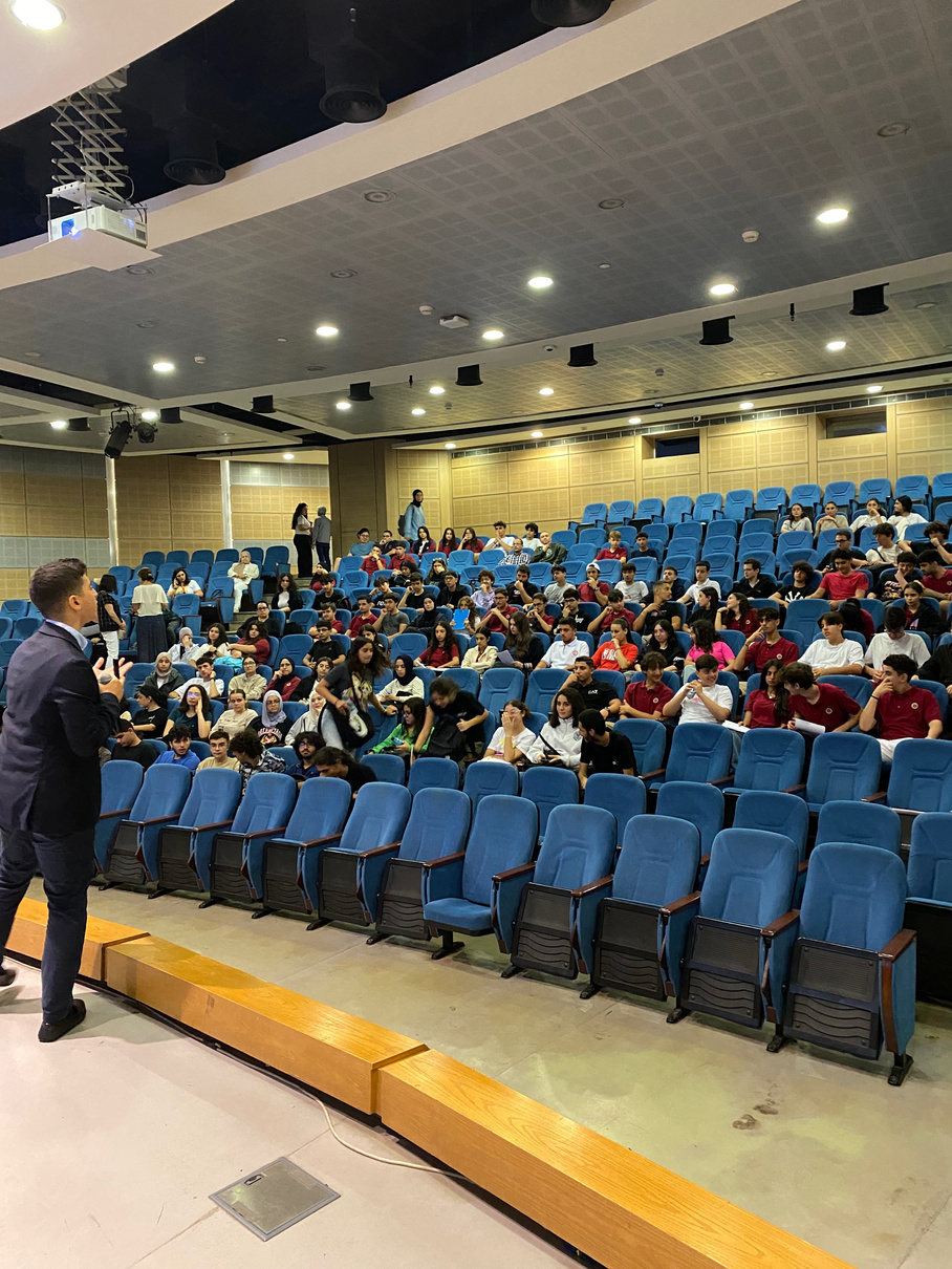 Future Debate Masters speaker addressing students in an auditorium
